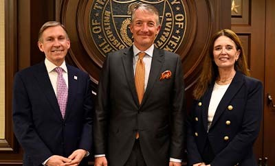 MD Anderson President Peter Pisters, UT Austin President Jay Hartzell and Dell Medical School Dean Claudia Lucchinetti stand together for a group portrait.