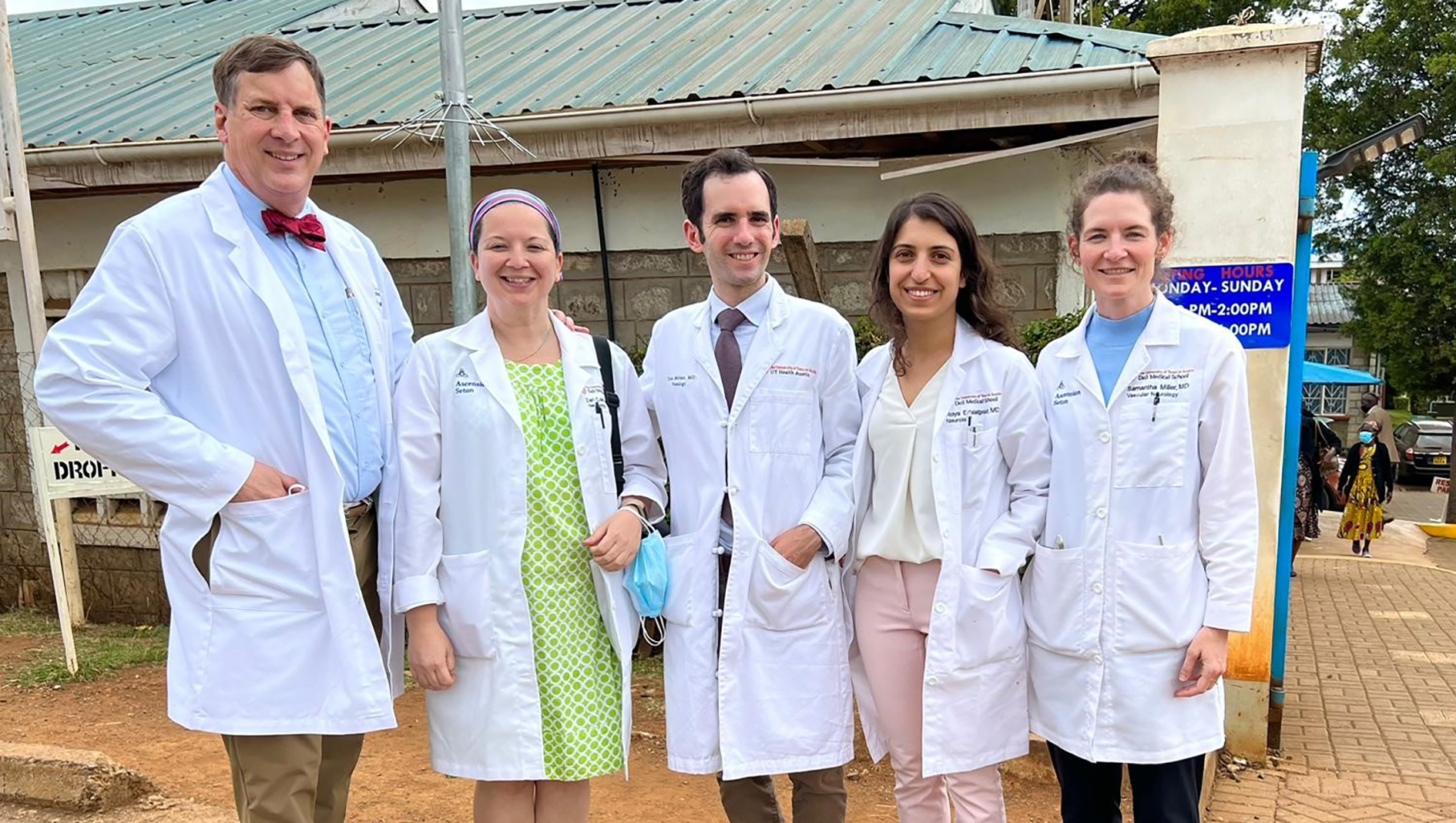 Group photo of neurology residents wearing white coats in Kenya.