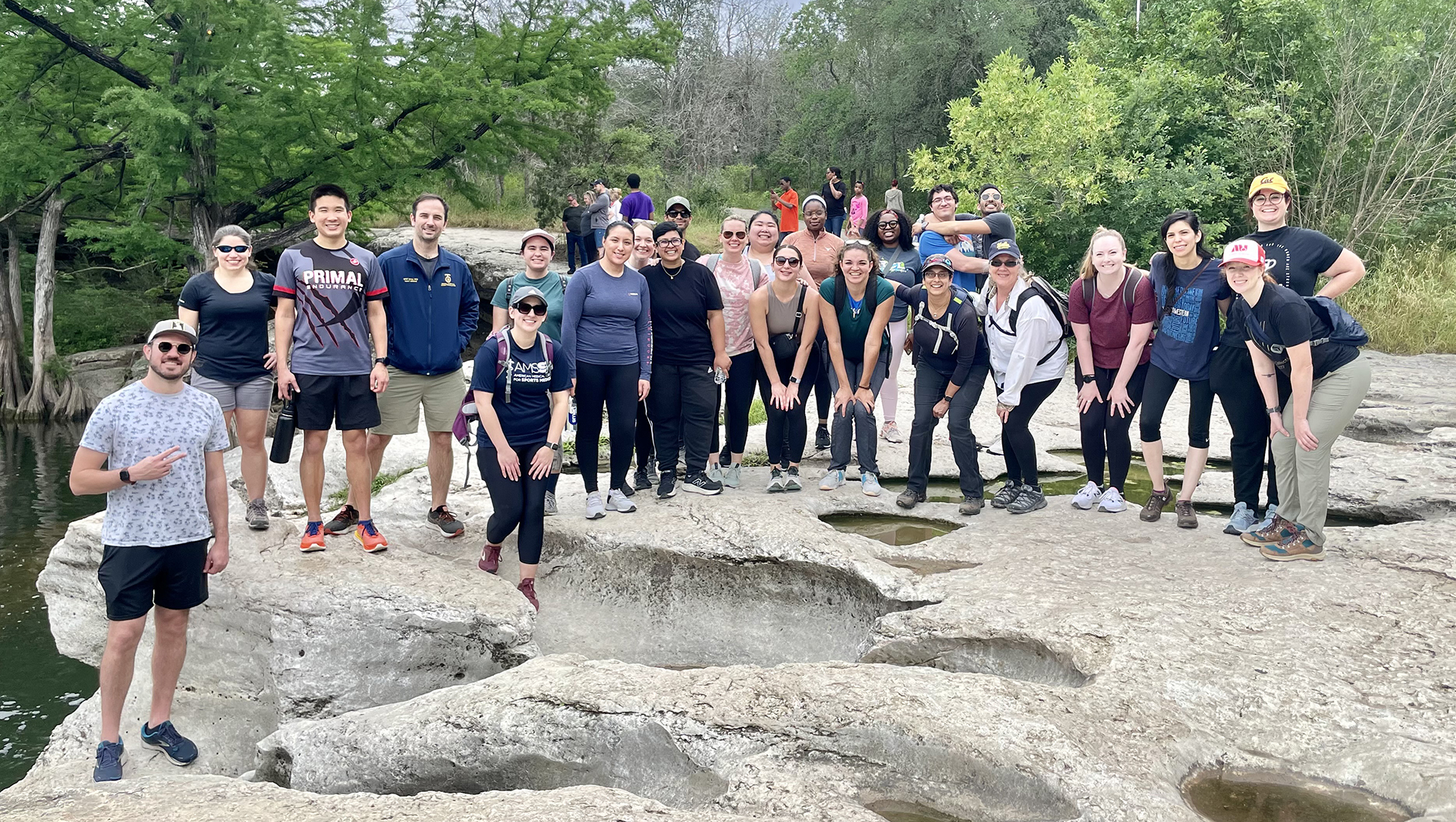 Group photo of family medicine residents outside during their spring retreat at McKinney Falls State Park