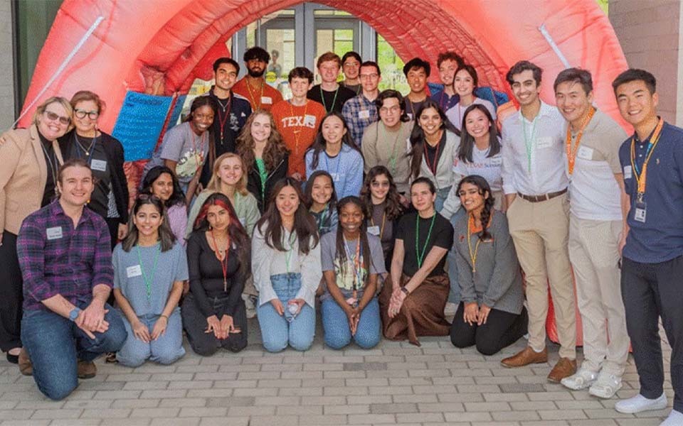 Cancer Genomics SPRINT participants gather for a group portrait outside the Dell Medical School campus.