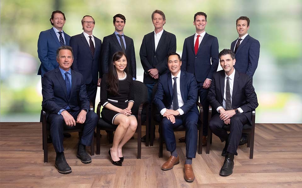 Faculty members affiliated with both the Ophthalmology Residency and Austin Retina Associates pose together in a professional group portrait in business attire.