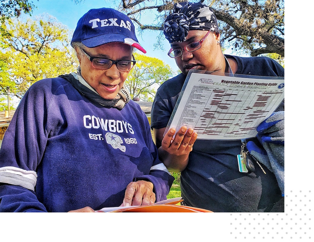 Two women gardening.