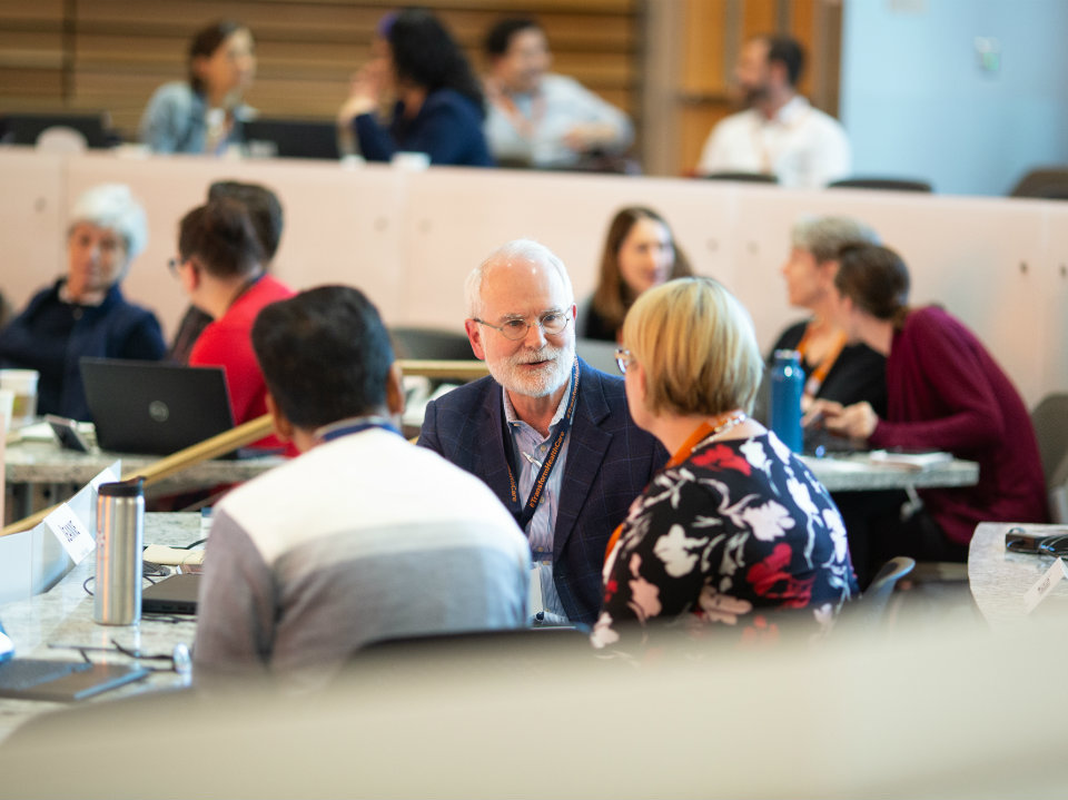 A group of health leaders convene for a workshop