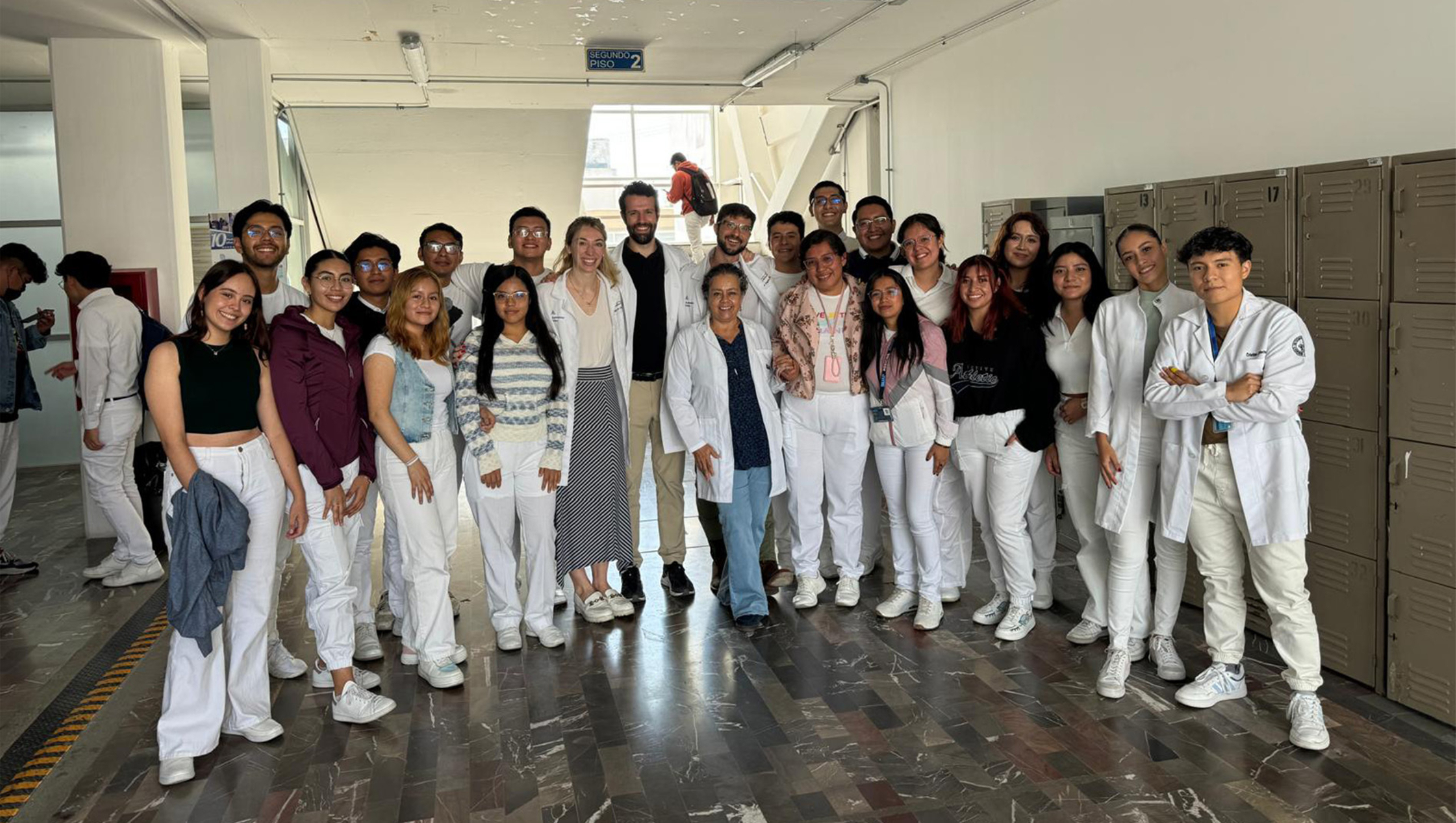 Dell Med psychiatry residents and Benemérita Universidad Autónoma de Puebla medical school students gather for a group photo.