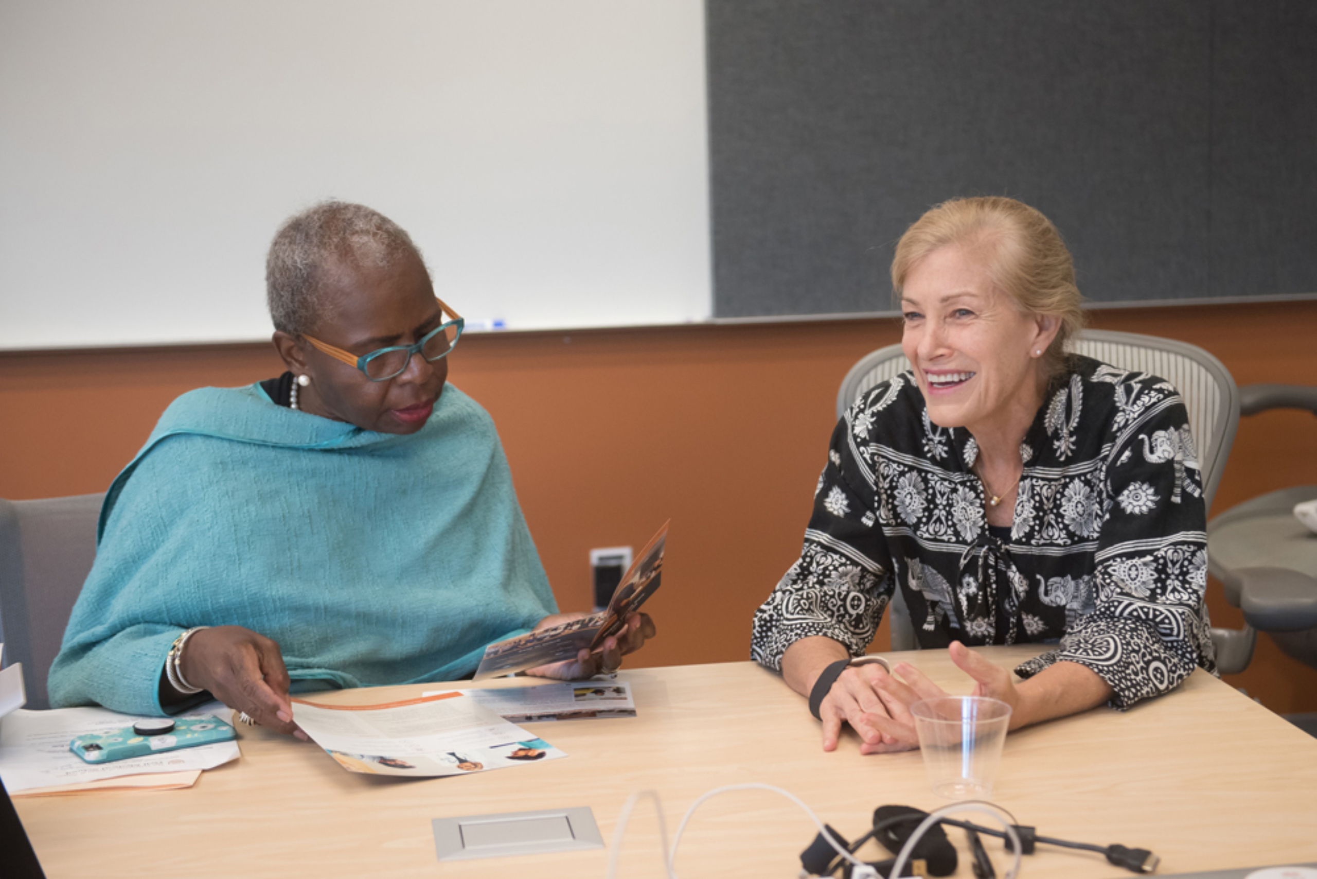 Elizabeth Teisberg reviews material with a participant during the Musculoskeletal Institute's Immersion Program in Value-Based Health Care.