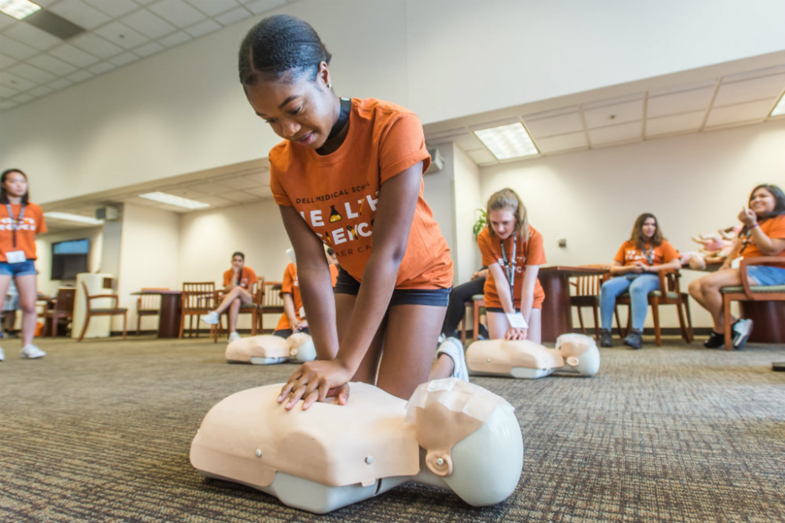 Summer camp participant undergoes CPR training