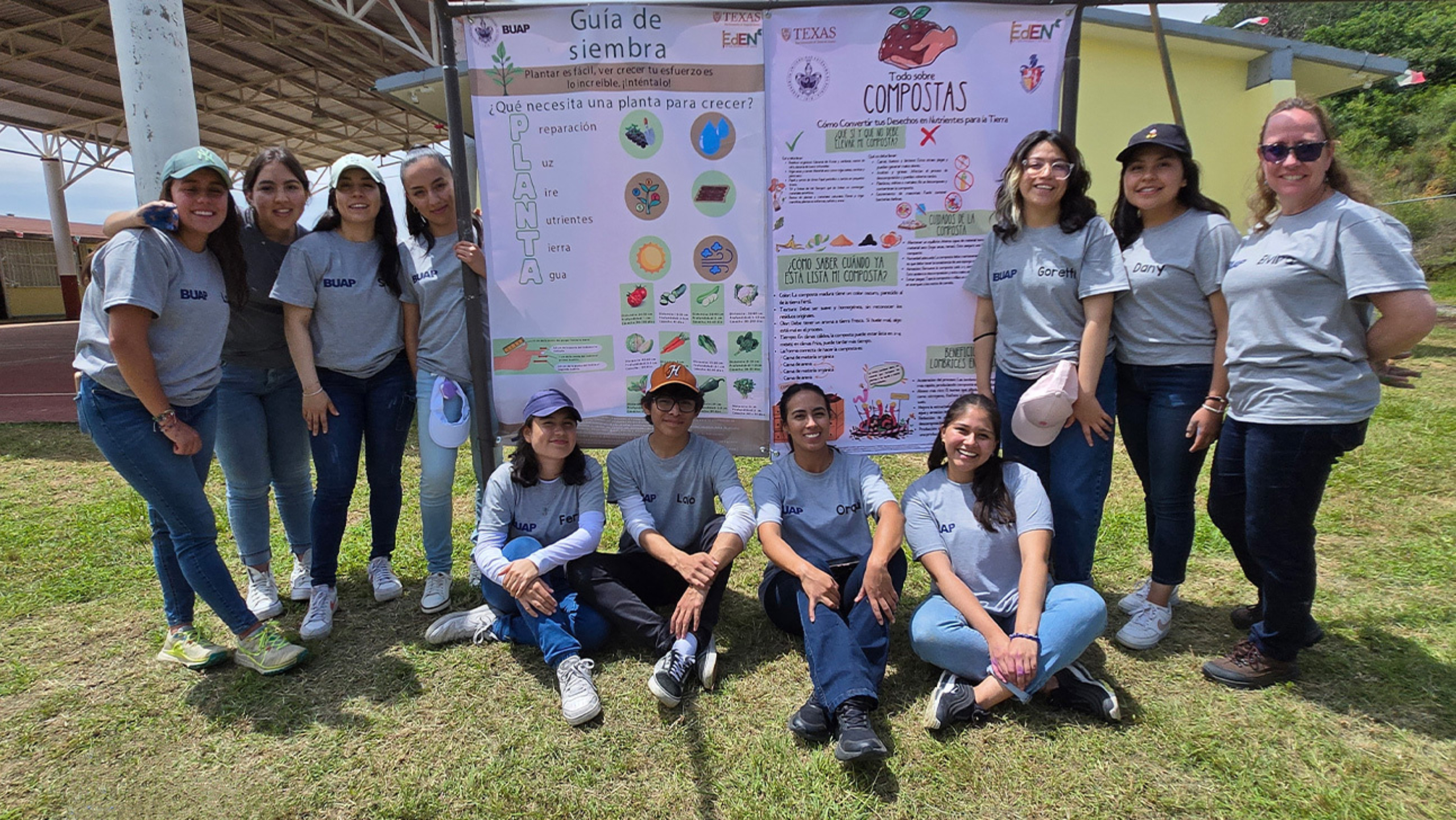 Members of the Benemérita Universidad Autónoma de Puebla stand in front of research posters.