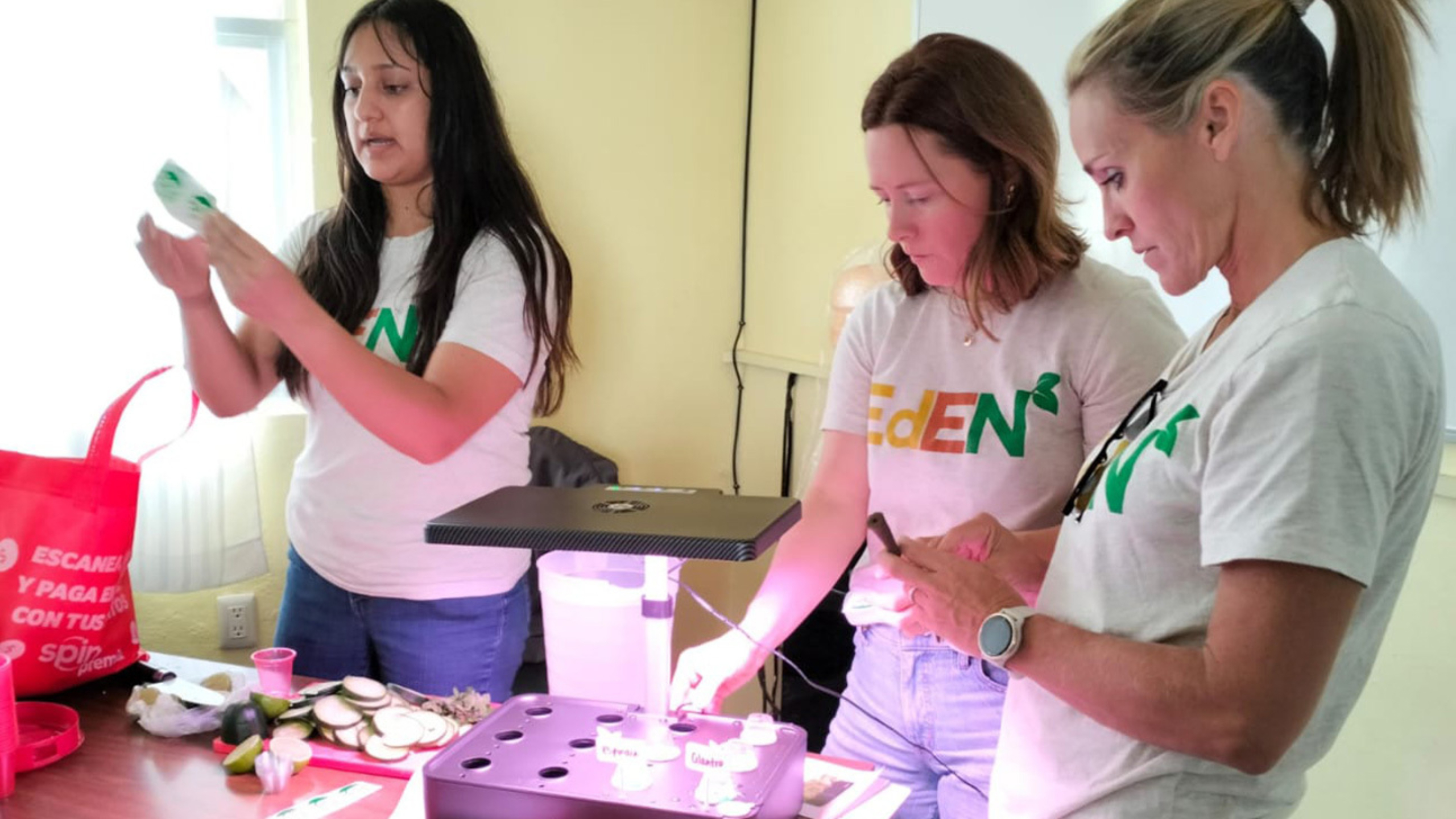 Members of the Eden Lab demonstrate an activity inside a classroom.