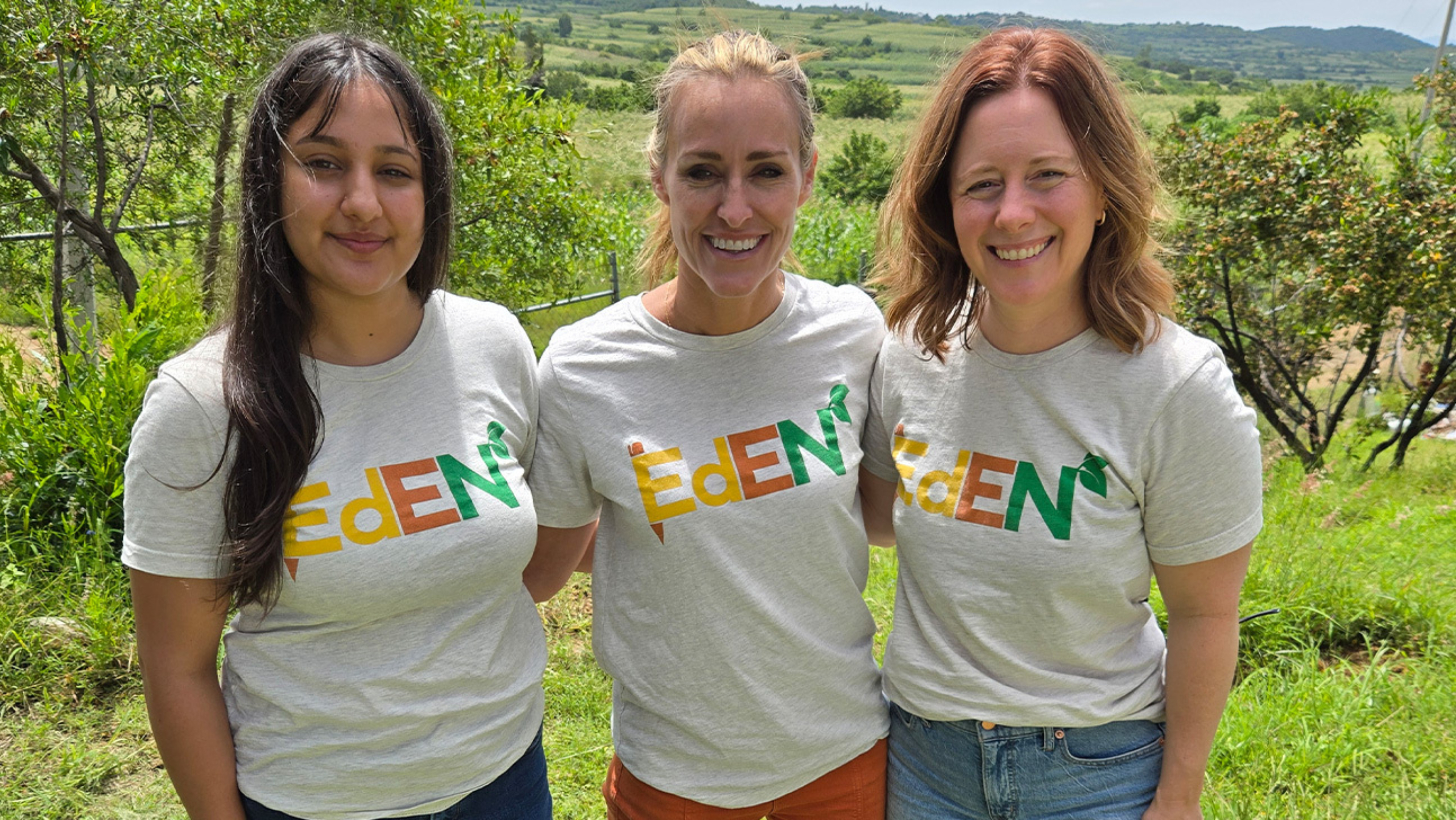 Three members affiliated with the EdEN Lab stand together for a group photo.