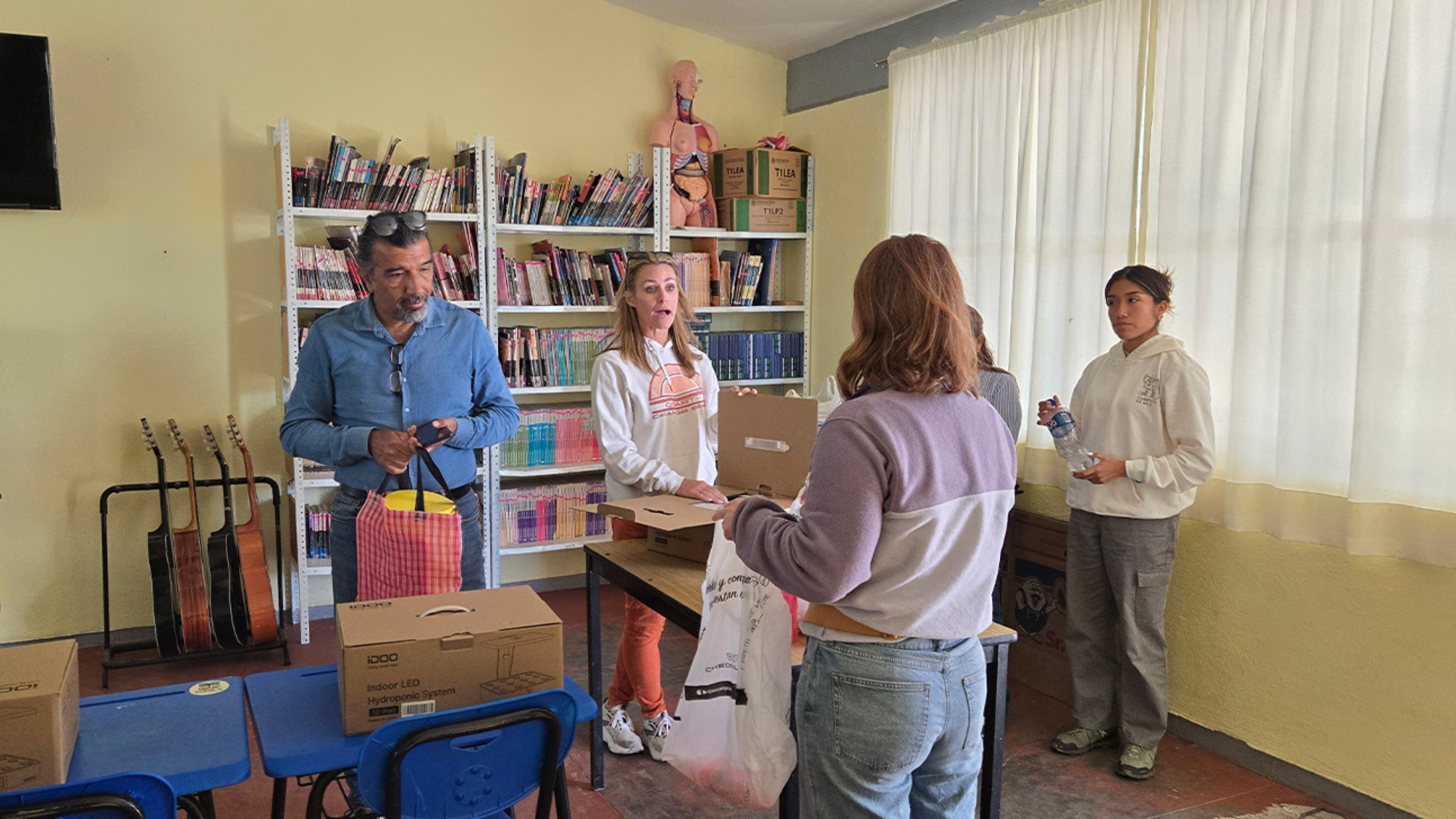 Members of the Division of Global health have a small group discussion with local researchers.