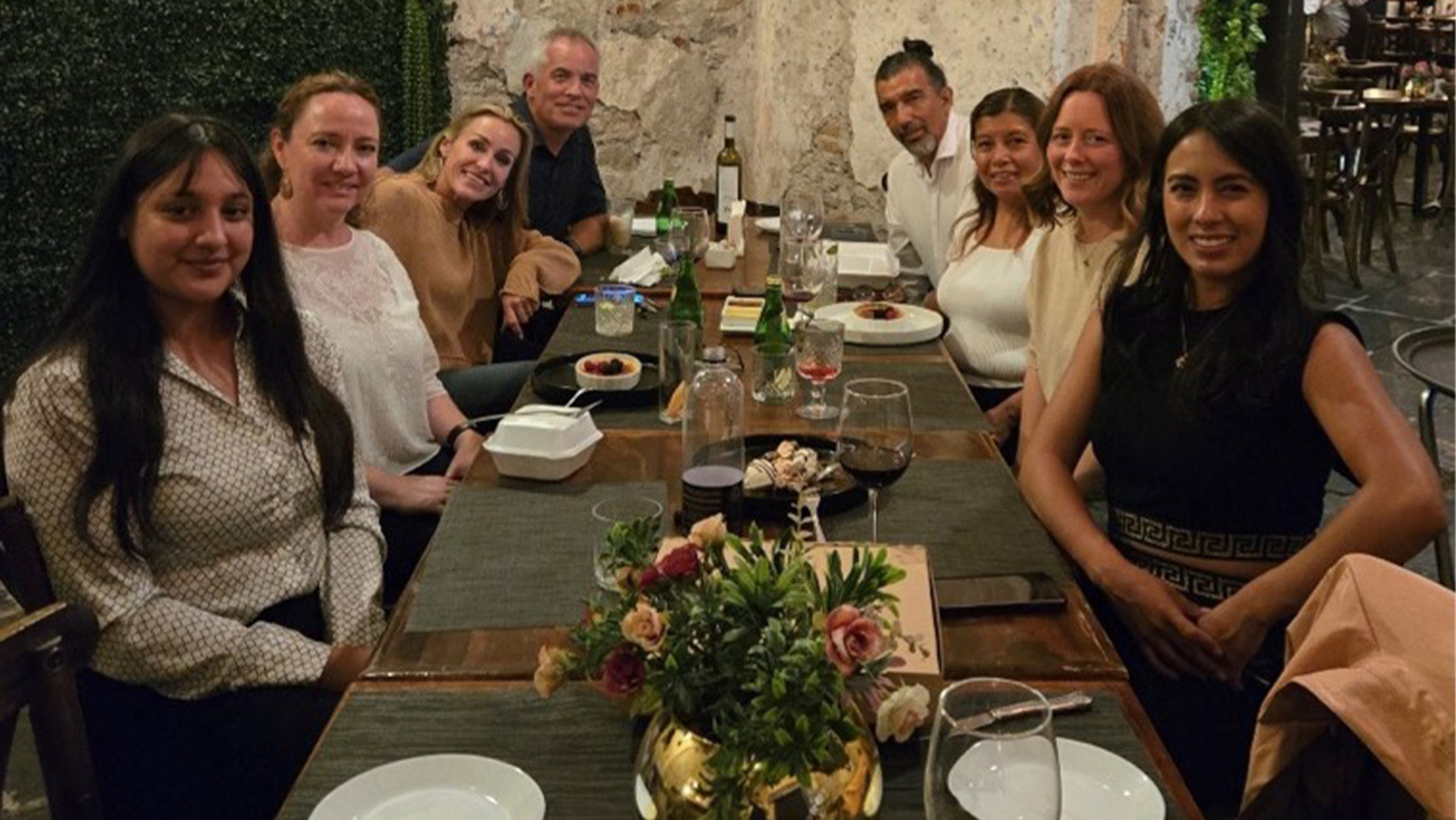 Members of the Division of Global Health all seated at a team dinner.